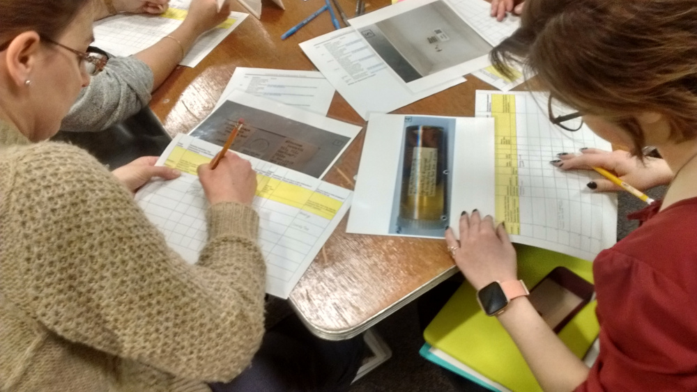 workshop participants transcribing labels.